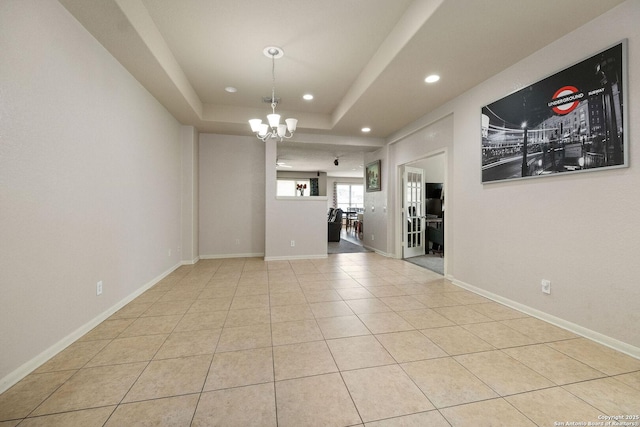 12602 Fiesta, San Antonio, TX 78245 - unfurnished room featuring recessed lighting, a chandelier, light tile patterned floors, baseboards, and a tray ceiling