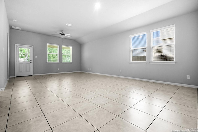 12466 Belfort Pt, Schertz, TX 78154 - empty room featuring ceiling fan, light tile patterned flooring, baseboards, and vaulted ceiling