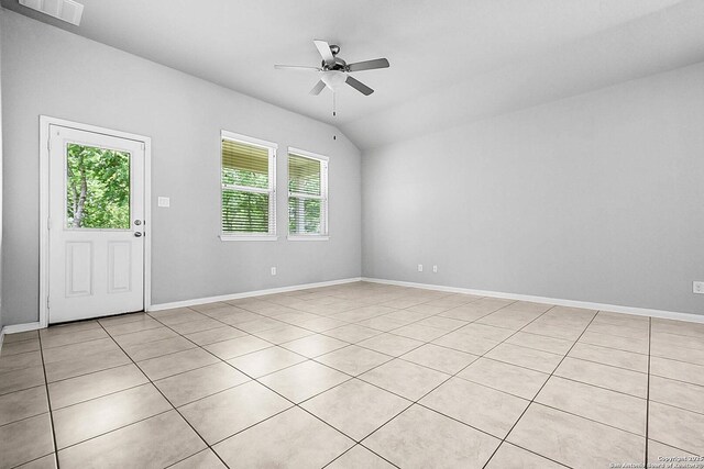 12466 Belfort Pt, Schertz, TX 78154 - spare room featuring a ceiling fan, light tile patterned floors, lofted ceiling, and baseboards