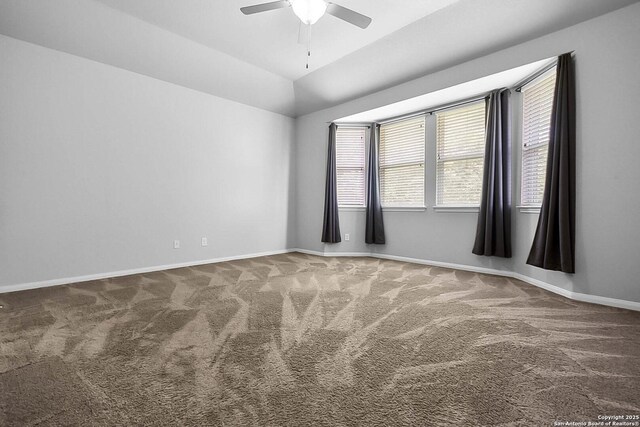 12466 Belfort Pt, Schertz, TX 78154 - empty room with carpet floors, ceiling fan, baseboards, and lofted ceiling