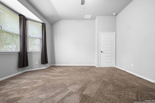 12466 Belfort Pt, Schertz, TX 78154 - empty room featuring carpet flooring, vaulted ceiling, ceiling fan, and baseboards