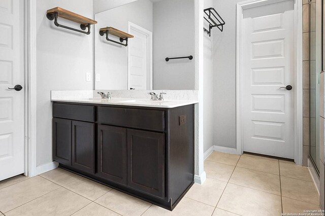 12466 Belfort Pt, Schertz, TX 78154 - bathroom featuring tile patterned floors, baseboards, and double vanity
