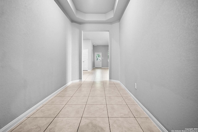 12466 Belfort Pt, Schertz, TX 78154 - corridor featuring light tile patterned floors, baseboards, and a textured wall