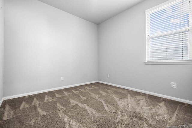 12466 Belfort Pt, Schertz, TX 78154 - unfurnished room with dark colored carpet, baseboards, and lofted ceiling