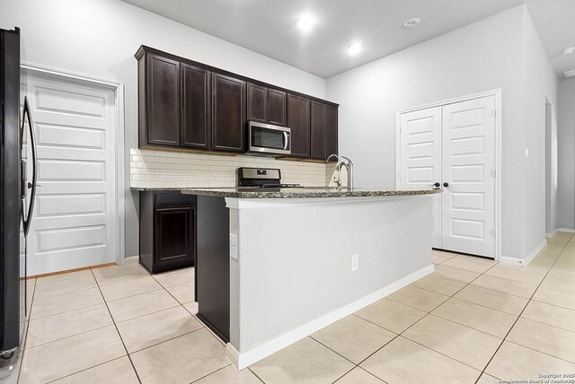 12466 Belfort Pt, Schertz, TX 78154 - kitchen featuring stainless steel appliances, light tile patterned flooring, tasteful backsplash, stone countertops, and recessed lighting