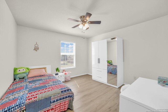 3628 Lazy Diamond, Selma, TX 78154 - bedroom with light wood-type flooring, baseboards, and a ceiling fan