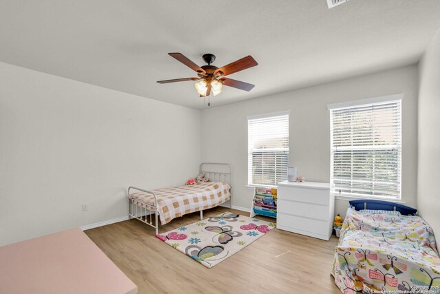 3628 Lazy Diamond, Selma, TX 78154 - bedroom with light wood finished floors, baseboards, and ceiling fan