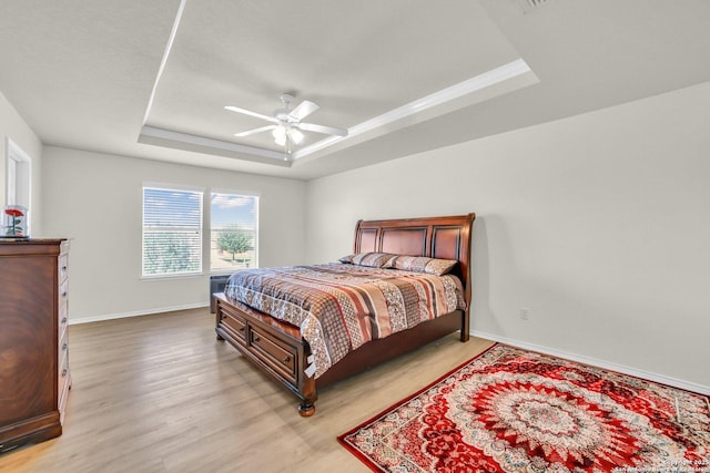 3628 Lazy Diamond, Selma, TX 78154 - bedroom with a raised ceiling, light wood finished floors, baseboards, and a ceiling fan