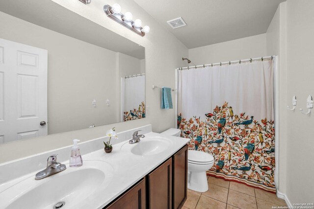 3628 Lazy Diamond, Selma, TX 78154 - full bath with tile patterned floors, toilet, double vanity, and a shower with shower curtain