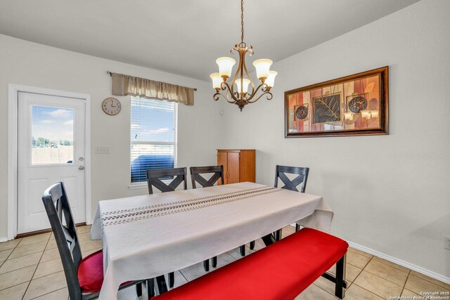 3628 Lazy Diamond, Selma, TX 78154 - dining room with a chandelier, light tile patterned floors, and baseboards