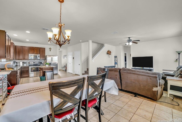 3628 Lazy Diamond, Selma, TX 78154 - dining room featuring light tile patterned flooring, stairway, ceiling fan, a chandelier, and recessed lighting
