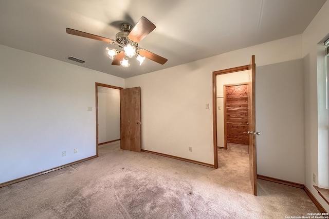 2721 Barton Hl, Bulverde, TX 78163 - unfurnished bedroom with light carpet, baseboards, and ceiling fan