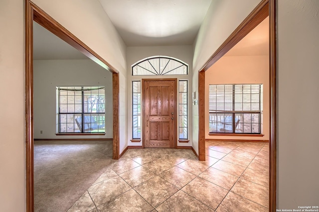 2721 Barton Hl, Bulverde, TX 78163 - entrance foyer with healthy amount of natural light, light tile patterned flooring, and baseboards