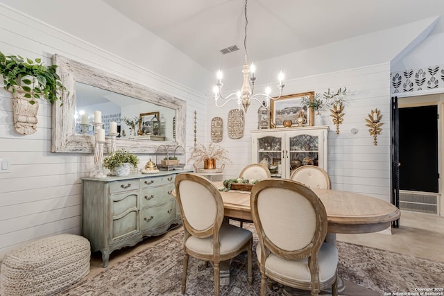 7500 Callaghan Rd Unit 108, San Antonio, TX 78229 - dining area with a chandelier and wood walls