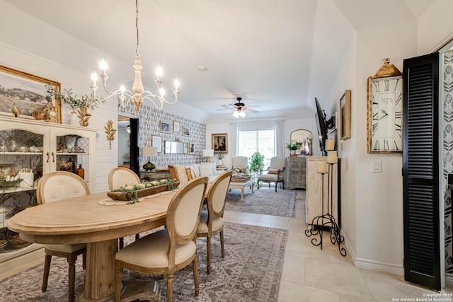 7500 Callaghan Rd Unit 108, San Antonio, TX 78229 - dining space featuring light tile patterned floors, ceiling fan, baseboards, and a chandelier