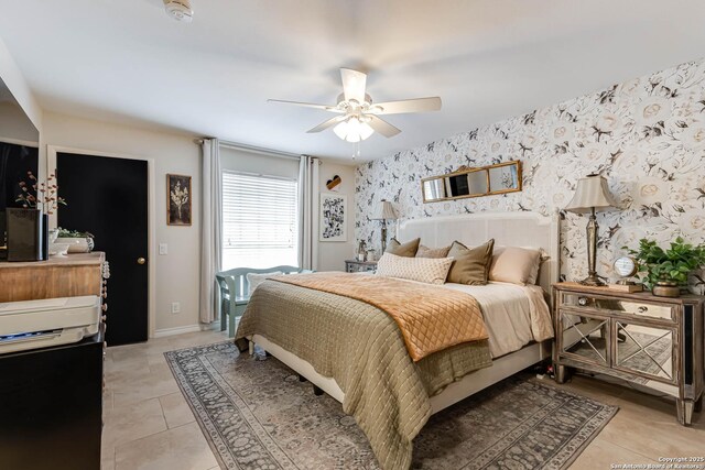7500 Callaghan Rd Unit 108, San Antonio, TX 78229 - bedroom with wallpapered walls, light tile patterned floors, ceiling fan, and baseboards