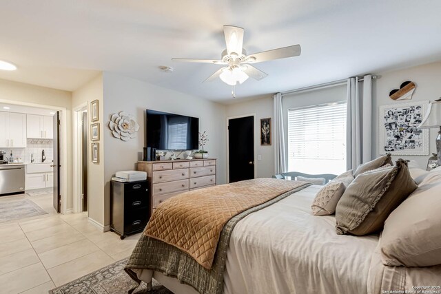 7500 Callaghan Rd Unit 108, San Antonio, TX 78229 - bedroom with light tile patterned flooring, a sink, ceiling fan, and connected bathroom