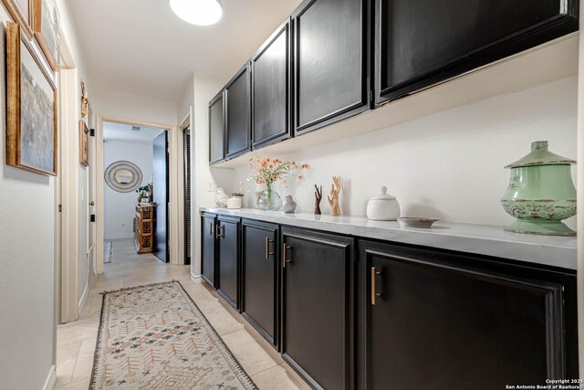7500 Callaghan Rd Unit 108, San Antonio, TX 78229 - bar area with light tile patterned floors and baseboards