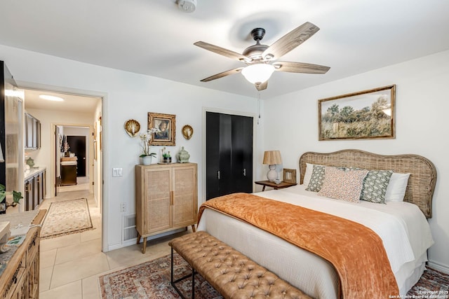 7500 Callaghan Rd Unit 108, San Antonio, TX 78229 - bedroom with light tile patterned floors and a ceiling fan