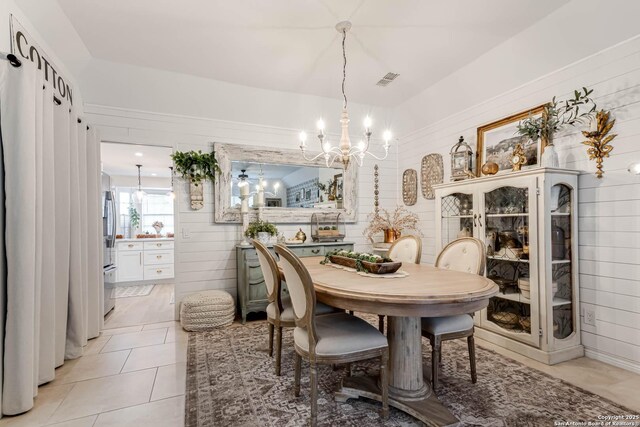 7500 Callaghan Rd Unit 108, San Antonio, TX 78229 - dining room featuring a chandelier and light tile patterned flooring
