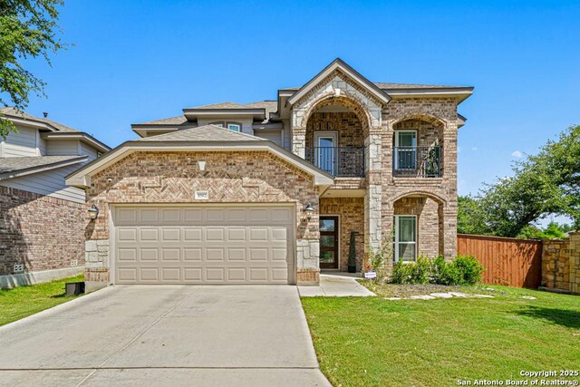8502 Kallison Arbor, San Antonio, TX 78254 - view of front of property featuring a balcony, driveway, a garage, and brick siding