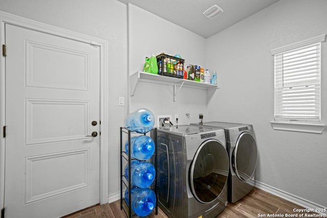 8502 Kallison Arbor, San Antonio, TX 78254 - laundry room with wood finished floors, washer and clothes dryer, and baseboards
