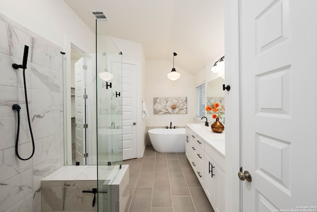 2230 Bennett Ave, New Braunfels, TX 78132 - full bath featuring a stall shower, a soaking tub, vanity, vaulted ceiling, and tile patterned floors