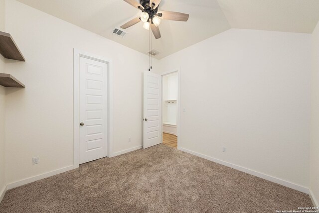 2230 Bennett Ave, New Braunfels, TX 78132 - unfurnished bedroom with carpet flooring, baseboards, ceiling fan, and lofted ceiling