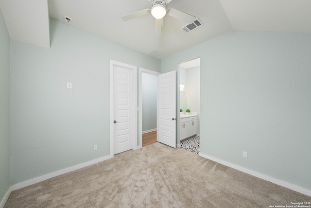 2230 Bennett Ave, New Braunfels, TX 78132 - unfurnished bedroom featuring light colored carpet, vaulted ceiling, baseboards, connected bathroom, and a ceiling fan