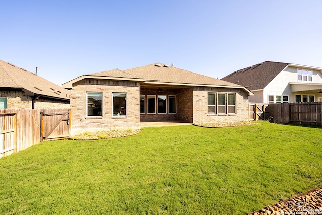 2230 Bennett Ave, New Braunfels, TX 78132 - back of property with a gate, brick siding, a patio area, a shingled roof, and ceiling fan