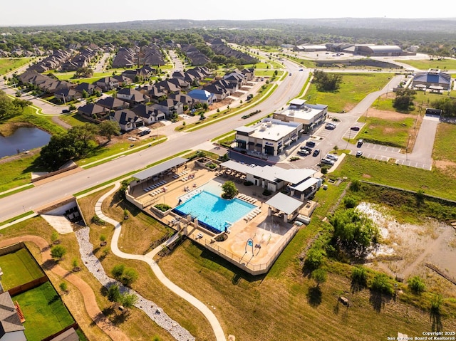 2230 Bennett Ave, New Braunfels, TX 78132 - aerial view of property and surrounding area with a pool area, a nearby body of water, and nearby suburban area