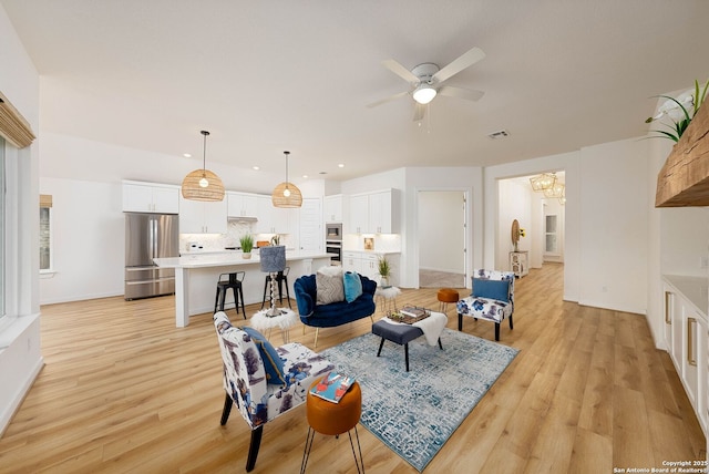 2230 Bennett Ave, New Braunfels, TX 78132 - living area featuring light wood-type flooring, a chandelier, a ceiling fan, recessed lighting, and baseboards