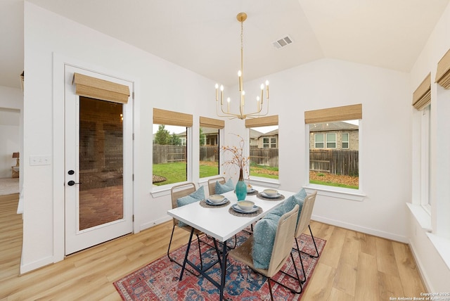 2230 Bennett Ave, New Braunfels, TX 78132 - dining space with a chandelier, light wood-type flooring, and vaulted ceiling