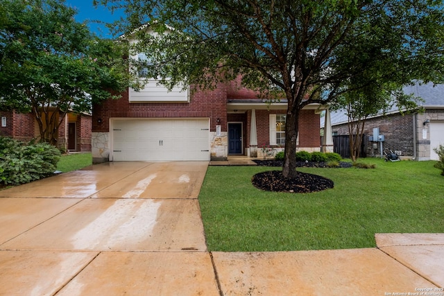 26206 Presidio Mesa, Boerne, TX 78015 - view of front of property featuring brick siding, a front yard, driveway, stone siding, and an attached garage