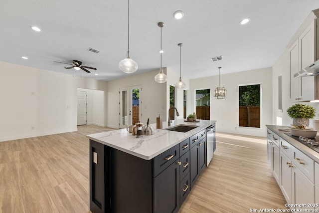 1310 S Mesquite, San Antonio, TX 78210 - kitchen featuring a sink, dishwasher, light wood-style floors, white cabinets, and recessed lighting