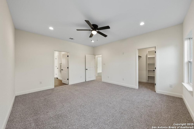 1310 S Mesquite, San Antonio, TX 78210 - unfurnished bedroom featuring carpet floors, a spacious closet, baseboards, recessed lighting, and a ceiling fan