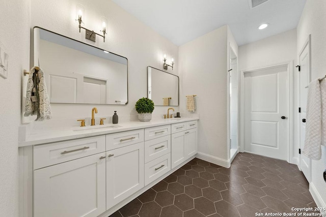 1310 S Mesquite, San Antonio, TX 78210 - full bath with double vanity, tile patterned floors, baseboards, recessed lighting, and a shower