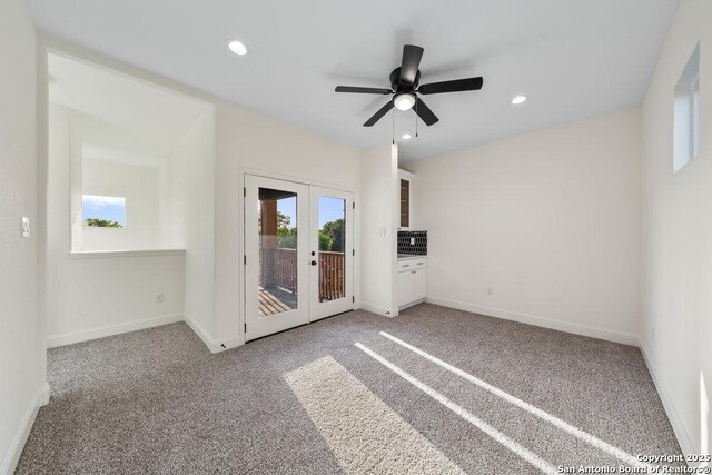 1310 S Mesquite, San Antonio, TX 78210 - carpeted empty room featuring baseboards, recessed lighting, a ceiling fan, and french doors
