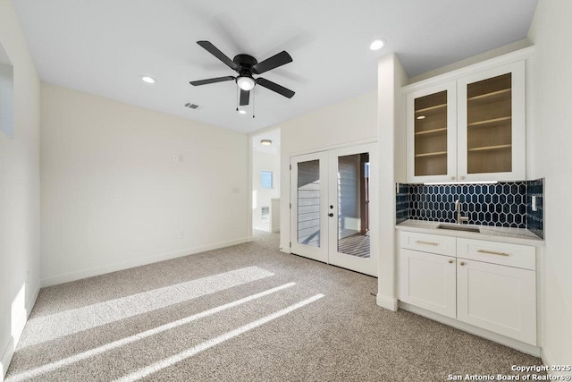 1310 S Mesquite, San Antonio, TX 78210 - spare room featuring a sink, french doors, light carpet, recessed lighting, and ceiling fan