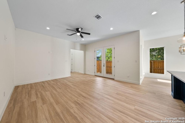 1310 S Mesquite, San Antonio, TX 78210 - unfurnished living room featuring light wood finished floors, ceiling fan, recessed lighting, and baseboards