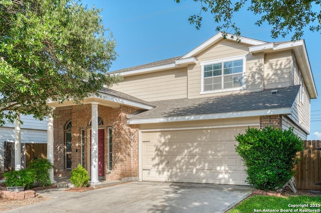 view of front of house with brick siding, fence, driveway, a shingled roof, and a garage