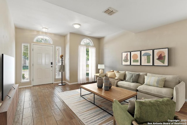 living area featuring wood finished floors and baseboards
