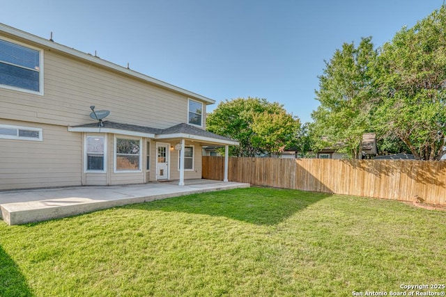 rear view of property featuring a patio area