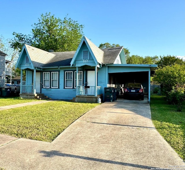 512 E Travis St, Luling, TX 78648 - view of front of property with driveway, roof with shingles, a front lawn, and a carport