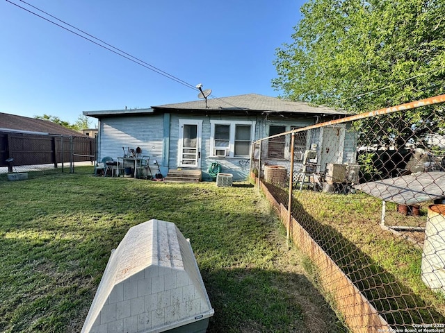 512 E Travis St, Luling, TX 78648 - back of house featuring entry steps and central AC