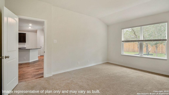 310 Steele Hbr, Cibolo, TX 78108 - carpeted empty room with lofted ceiling and baseboards