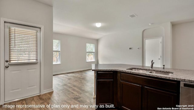 310 Steele Hbr, Cibolo, TX 78108 - kitchen with dishwasher, light stone counters, wood finished floors, and dark brown cabinetry