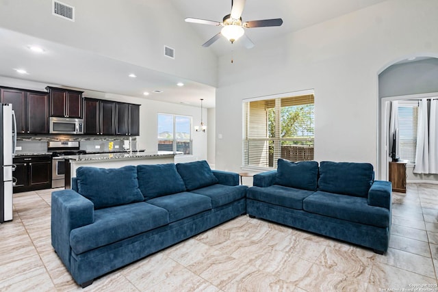 9870 Mulhouse, Schertz, TX 78154 - living room with ceiling fan, a towering ceiling, recessed lighting, and arched walkways