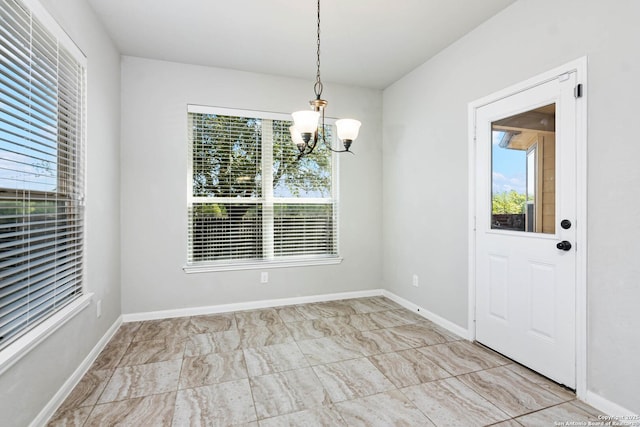 9870 Mulhouse, Schertz, TX 78154 - unfurnished dining area with a chandelier and baseboards