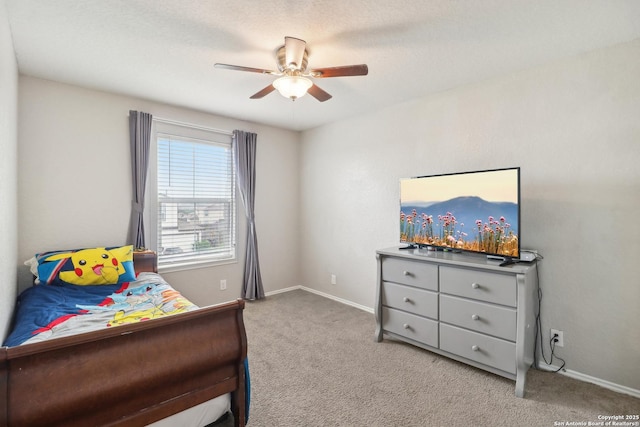 bedroom featuring carpet floors, baseboards, and ceiling fan